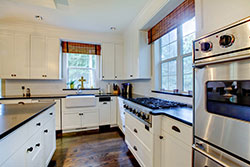 black granite white cabinets Granite kitchen - Denver Metro Stone City LLC